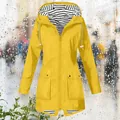 Detailed view of yellow women's raincoat with striped hood lining and zip closure - S / Top (Split Hem Style) / Yellow