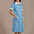 Detailed view of a light blue healthcare worker uniform dress with white collar and pockets - S / Top And Bottom / Light Blue