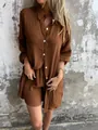 Detailed view showing the crinkle fabric texture of this brown two-piece shirt and shorts set - Dark Brown