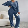 Detailed view of women's blue ribbed knit two-piece set with V-neck top and wide-leg pants - Navy Blue