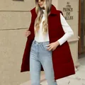 Detail showing a long quilted red puffer vest for women with zip closure and buttons. - S / Tops / Dark Red