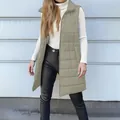 Full view of women's long khaki green puffer vest with zipper and pockets detail - Bean Green
