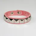 Handmade pink punk faux leather bracelet featuring silver pyramid studs and snap buttons - Single Row / Pink