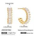 Detail view of gold-plated stainless steel C-shaped hoop earrings with oval cubic zirconia - Oval Zirconia Style (JDE0307082) / Gold