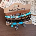 Close-up of bohemian multi-layer bracelet set with leather, wood beads, and metal charms. - Flower Theme (5-Piece Set) / One Size / Brown Silver Blue