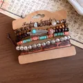 Detailed view of vintage leather and beaded bracelet set featuring feather and flower charms. - Feather Theme (6-Piece Set) / One Size / Coffee-Silver