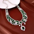 Macro view of luxury statement necklace featuring green gemstones, zircons and pearls - Necklace Only (Green) / Silver