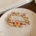Vintage gold floral buckle bracelet with pink rhinestones for luxury look. - Flower Bracelet / Gold-Rose Red