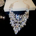 Detail of luxury teardrop crystal statement necklace with sparkling gold finish - Necklace - Gold