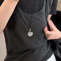 Minimalistische ketting in Zuid-Koreaanse stijl met getextureerde zilveren hanger - Korrelige Textuur Ovaal-Zilver-Zwart Koord