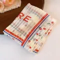 Close-up of a polyester square bandana with floral and checkered prints - Floral Stripe And RE Letter Style / Red-Blue