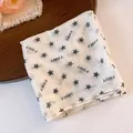 Detailed view of white polyester square bandana featuring black star and letter prints - Pentagram And FMNY Letter Style / Green-Beige