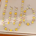 Elegante conjunto de joyas con circonitas amarillas y melocotón, collar y pendientes. - Juego de 3 piezas (collar+pulsera+pendientes) / Plata-Amarillo Café