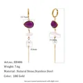 Detailed view of gold-plated stainless steel tassel earrings with purple stones and pearls. - Gold with Purple Pendant