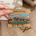 Detailed view of bohemian layered bracelet set with heart charms and beads - Brown Blue Silver Heart / Layered Set