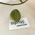 Detail of translucent green jelly resin ring with a unique smooth oval pebble-like shape - 44# Transparent Green