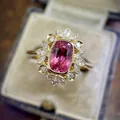 Detailed view of a vintage sunburst ring featuring a pink zircon and clear marquise stones. - Size 5 / Pink Cushion Cut Style (CY1039)
