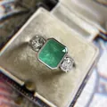 Detailed close-up of vintage style emerald-cut green zircon engagement ring in box - Size 6 / Emerald Cut Vintage Ring (CY1000) / Green
