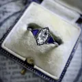 Macro view of marquise-cut zircon engagement ring in vintage box packaging - Size 5 / Marquise Cut Clear Style (CY907)