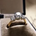 Close-up of vintage three-stone engagement ring with sparkling cubic zirconia - Size 5 / Clear Three-Stone Style (CY786)