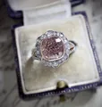 Macro detail of a vintage-style ring with a pink cushion-cut stone in a velvet box. - Size 5 / Pink Cushion Cut Style (CY732)