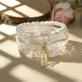 Bohemian style layered bracelet set with white pearls and gold bow charms - Stackable Bracelet Set / White