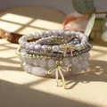 Bohemian stacked bracelet set with glass beads, imitation pearls and gold bow charms - Stackable Bracelet Set / Grey/White