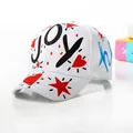 Detailed close-up of heart and star graffiti on the side of a white cotton baseball cap - Kids / White