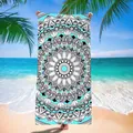 Vista completa de una toalla con diseño de mandala frente al horizonte de una playa tropical - Patrón de Mandala (Estilo 2) / Paquete 140x70