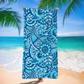 Vibrant blue mandala pattern on a quick-dry microfiber beach towel shown in a seaside view. - Blue Mandala Pattern / 120x60cm