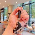 Portachiavi creativo a forma di pattino a rotelle con strass neri e argento - Nero