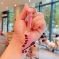 Portachiavi a pattino a rotelle con strass rosa e cinturino in pelle per auto e borse - Rosa