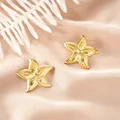 Elegant gold starfish stud earrings made of stainless steel displayed on silk fabric - Starfish Texture Style (E1308-A) / 1 Pair Pack / Gold