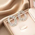 Elegant silver stainless steel leaf wreath stud earrings displayed in a gift box - Double Leaf Loop Style (E1320-B) / 1 Pair Pack / Steel