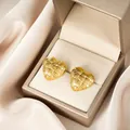 Elegant gold-plated stainless steel heart stud earrings with a woven textured finish. - Woven Heart Gold Style (E1378-A) / 1 Pair Pack / Gold