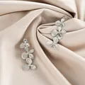 Elegant silver stainless steel earrings with triple flower design on silk fabric - Radiant Three-flower Series Style (E1339-B) / 1 Pair Pack / Steel