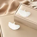 Elegant silver stainless steel earrings with textured irregular ginkgo leaf design - Radiant Ginkgo Leaf Style (E1325-B) / 1 Pair Pack / Steel