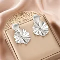 Elegant silver irregular stainless steel flower earrings with high-end fashion design - Radiant Ripple Silver Style (E1310-B) / 1 Pair Pack / Steel