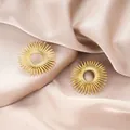 Elegant gold sunburst stainless steel stud earrings displayed on champagne satin fabric - Radiant Sunburst Style (E1341-A) / 1 Pair Pack / Gold
