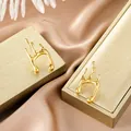 Modern irregular liquid metal stud earrings in polished gold-plated stainless steel - Liquid Metal Streamline Style (E1305-A) / 1 Pair Pack / Gold