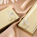High-end silver minimalist irregular fluid metal stud earrings in stainless steel - Fluid Geometric Silver Style (E1305-B) / 1 Pair Pack / Steel