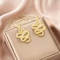 Elegant gold-plated stainless steel snake earrings on a jewelry box - Scaly Texture Snake Style (E1312-A) / 1 Pair Pack / Gold