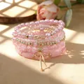 Bohemian pink stackable bracelet set with bow charms and faux pearls for stylish women - Stackable Bracelet Set / Pink