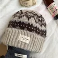 Vintage knit beanie with geometric patterns in warm beige and brown winter tones - Beige