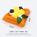 Realistic PU waffle model fake food prop for bakery display and photography - Triangle Waffle Mango (QHR-05987)