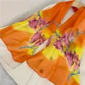 Detail view of vibrant orange and yellow chiffon long scarf with pink floral prints - Orange Yellow Gradient Pink Flower (33#) / 50-150cm