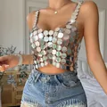 Close-up of silver metallic disc sequin backless crop top with a reflective finish - One Size / Tops / Silver