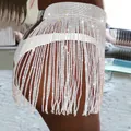 Close-up of sparkling rhinestone fringe mini skirt with mesh waist design - S / White