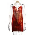 Close-up detail of a sexy red metallic chainmail mini dress with a deep V-neck design - XS / Red