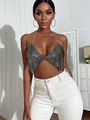 Close-up view of a sparkling silver sequin halter top worn by a model for party wear - One Size / Tops / Black